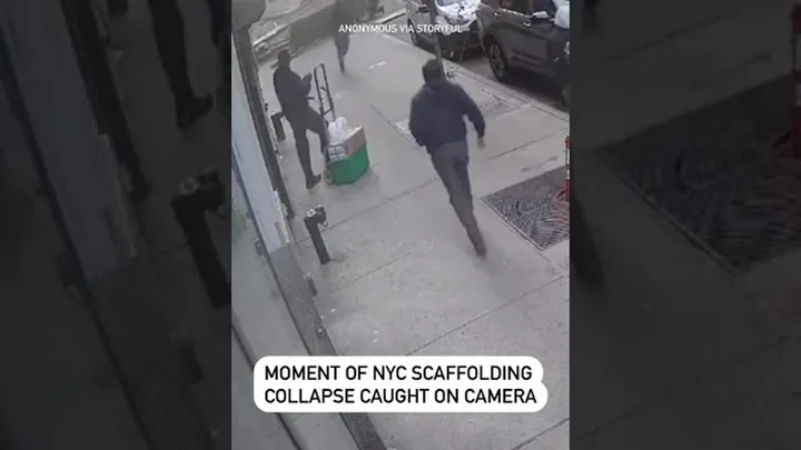 Video still: pedestrians on a New York pavement moments before a scaffold collapse